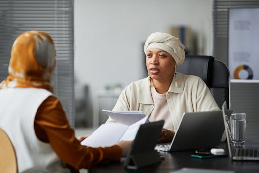 A consultant and client reviewing a project timeline