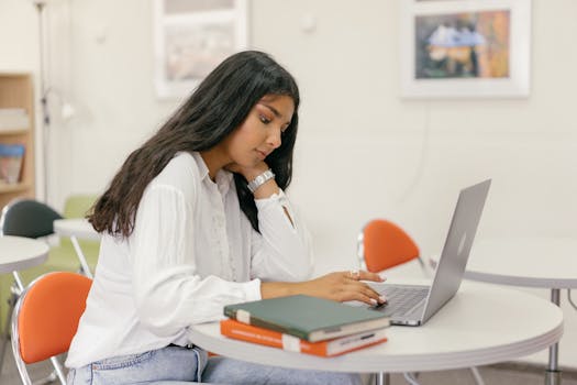 a person using a laptop for online learning